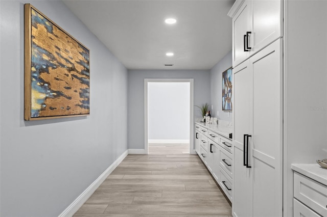 14485 Switch Back Rd, Brooksville, FL 34609 - corridor featuring light wood-style floors, recessed lighting, and baseboards