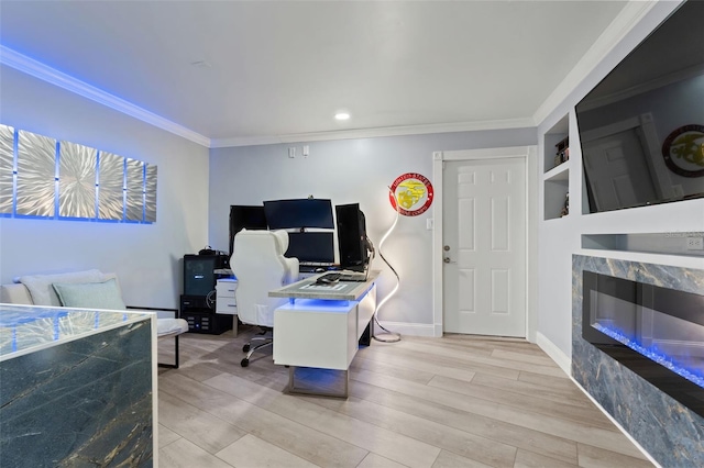 bedroom with ornamental molding and light hardwood / wood-style floors