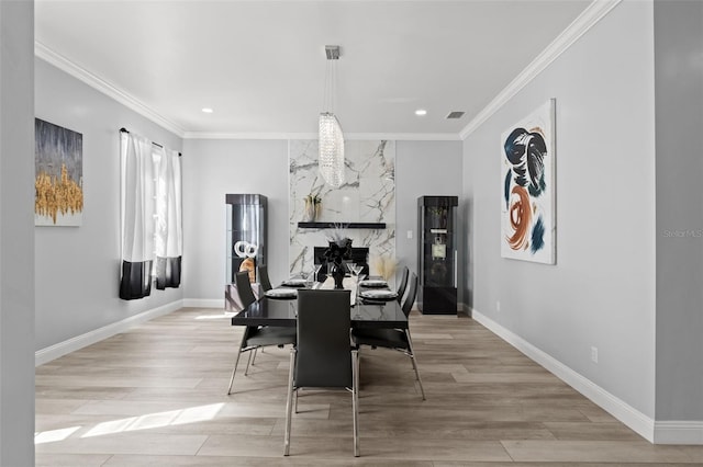 14485 Switch Back Rd, Brooksville, FL 34609 - dining area featuring recessed lighting, light wood finished floors, baseboards, and crown molding