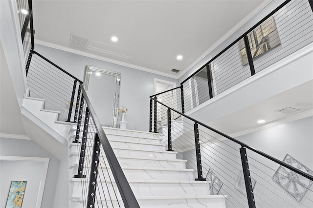 staircase with crown molding