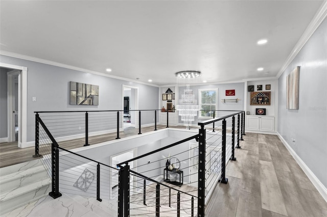 14485 Switch Back Rd, Brooksville, FL 34609 - hallway with an upstairs landing, recessed lighting, baseboards, crown molding, and a chandelier