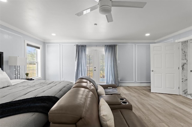 bedroom with ceiling fan, light wood-type flooring, and crown molding