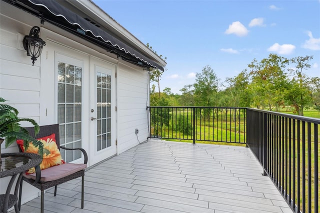 wooden terrace featuring french doors