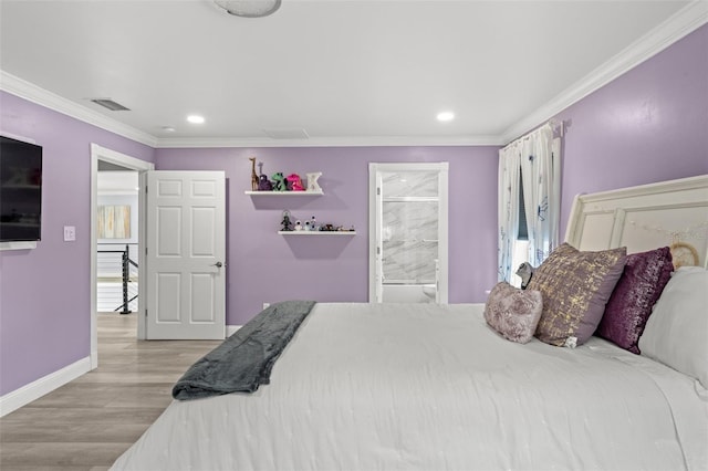 14485 Switch Back Rd, Brooksville, FL 34609 - bedroom featuring wood finished floors, ornamental molding, recessed lighting, baseboards, and ensuite bathroom