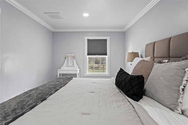 bedroom with ornamental molding