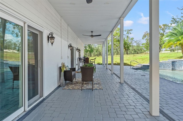 14485 Switch Back Rd, Brooksville, FL 34609 - view of patio / terrace featuring ceiling fan and an outdoor pool