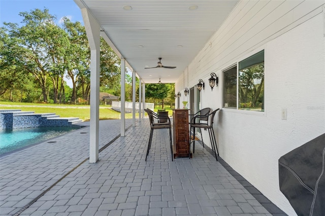 14485 Switch Back Rd, Brooksville, FL 34609 - view of patio / terrace with a ceiling fan, a hot tub, outdoor dining space, and an outdoor pool