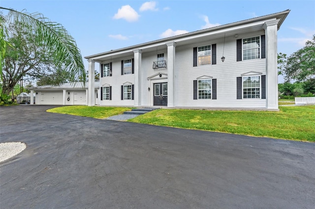 14485 Switch Back Rd, Brooksville, FL 34609 - greek revival house with a front yard and driveway