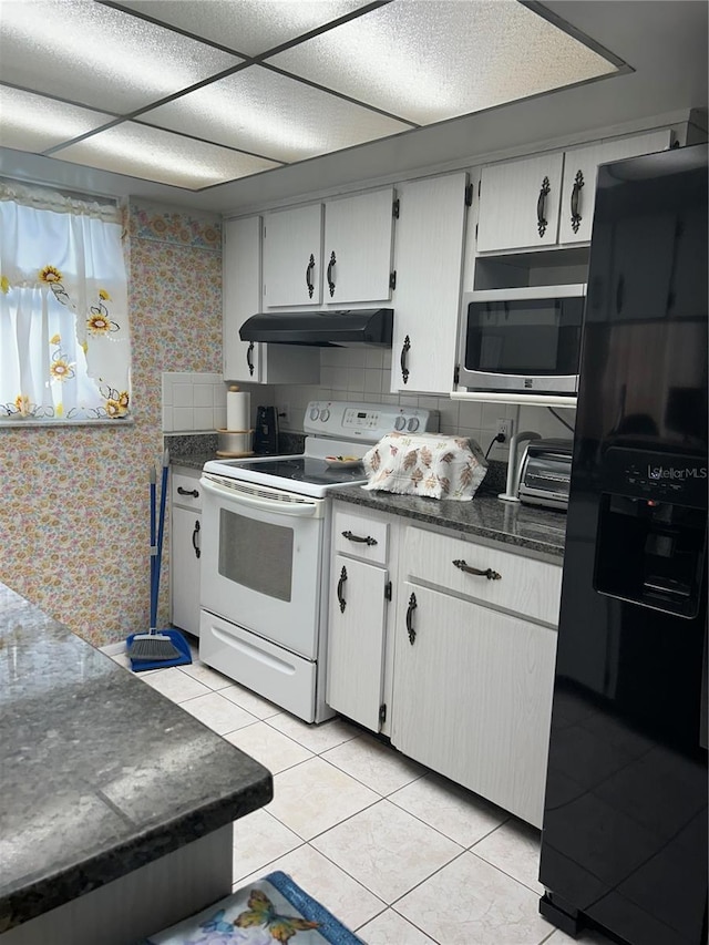 kitchen featuring white electric range, black fridge with ice dispenser, light tile patterned floors, and white cabinets