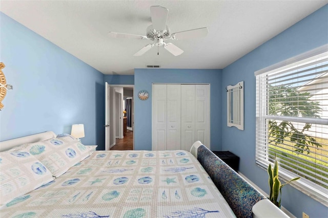8231 Coral Creek Loop, Hudson, FL 34667 - bedroom featuring a closet and ceiling fan
