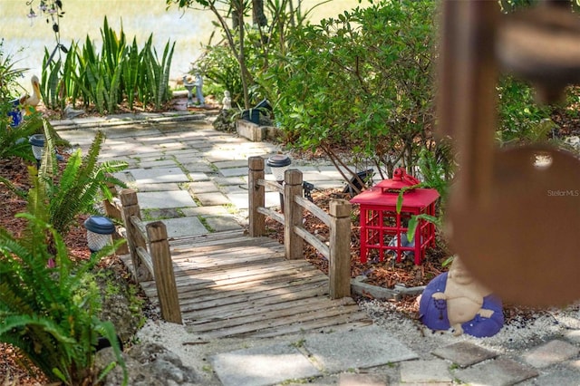 8231 Coral Creek Loop, Hudson, FL 34667 - view of community with a patio area