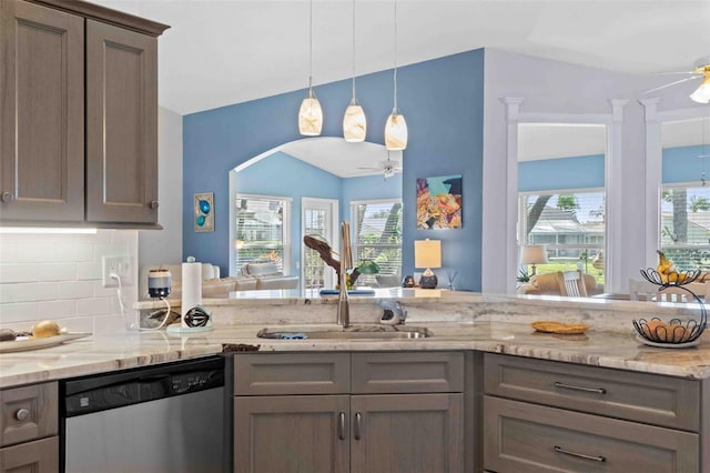 8231 Coral Creek Loop, Hudson, FL 34667 - kitchen with dishwasher, a ceiling fan, healthy amount of natural light, decorative backsplash, and lofted ceiling