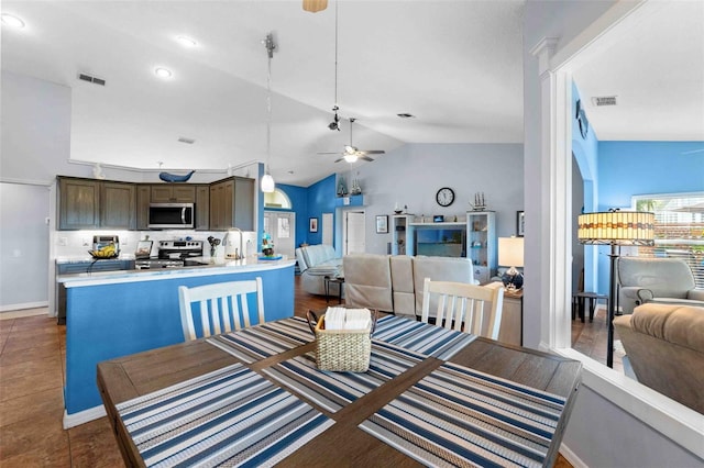 8231 Coral Creek Loop, Hudson, FL 34667 - dining room with a ceiling fan, lofted ceiling, recessed lighting, and baseboards