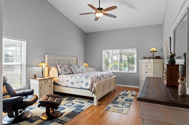 8231 Coral Creek Loop, Hudson, FL 34667 - bedroom featuring vaulted ceiling, wood finished floors, baseboards, and ceiling fan