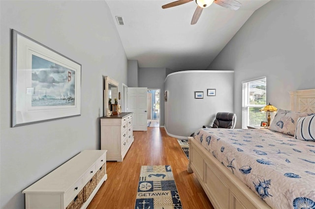 8231 Coral Creek Loop, Hudson, FL 34667 - bedroom featuring high vaulted ceiling, light wood-type flooring, and ceiling fan