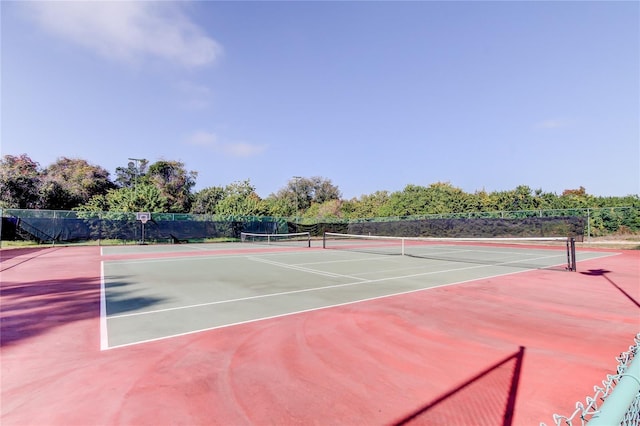 8231 Coral Creek Loop, Hudson, FL 34667 - view of tennis court featuring fence and community basketball court