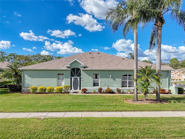 single story home with a front lawn