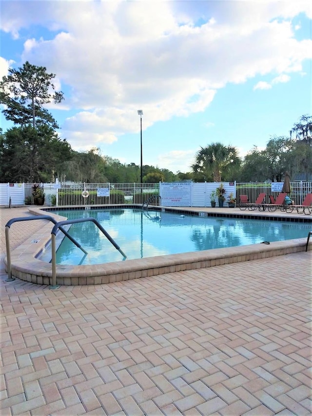 view of pool featuring a patio area