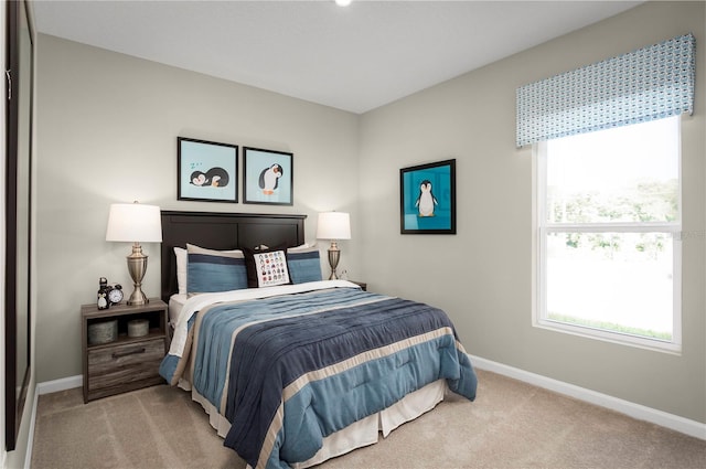 bedroom with light colored carpet