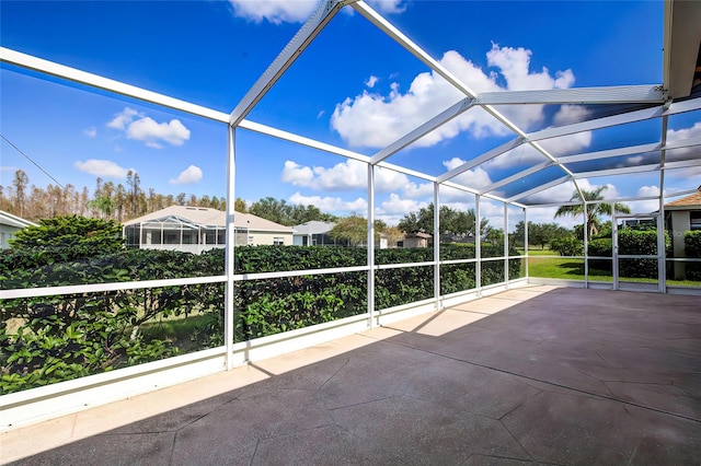 view of patio with glass enclosure