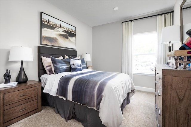 bedroom featuring light colored carpet