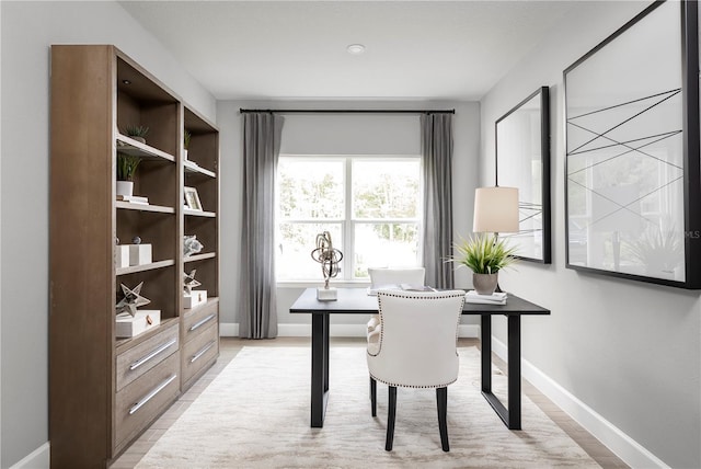 home office with light wood-type flooring