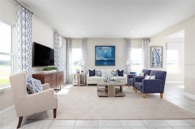 tiled living room featuring a healthy amount of sunlight