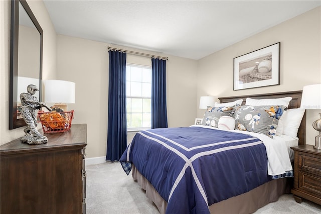 bedroom featuring light colored carpet