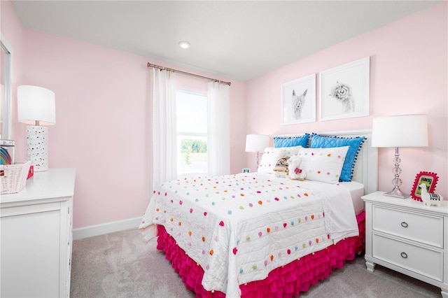 bedroom featuring light colored carpet