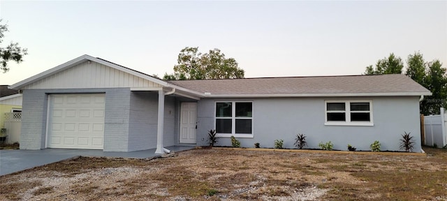 single story home featuring a garage