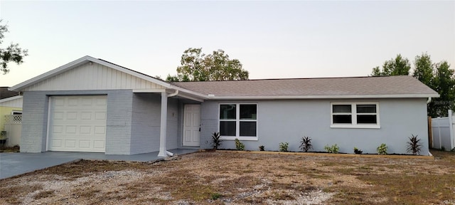 6417 Sutherland Ave, New Port Richey, FL 34653 - ranch-style house with an attached garage, concrete driveway, and roof with shingles