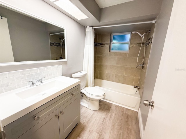 6417 Sutherland Ave, New Port Richey, FL 34653 - full bathroom with wood finished floors, shower / bath combo, toilet, backsplash, and vanity