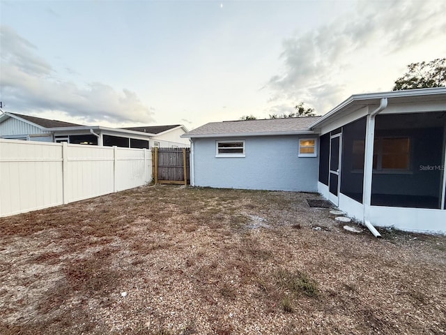 view of yard with a sunroom