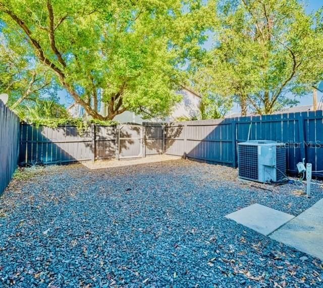 view of yard featuring central AC unit