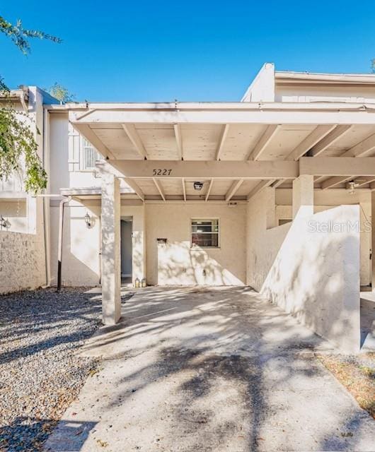 exterior space with a carport