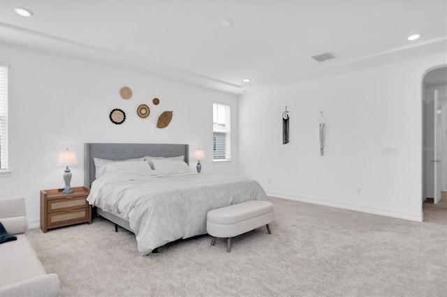 bedroom with light colored carpet