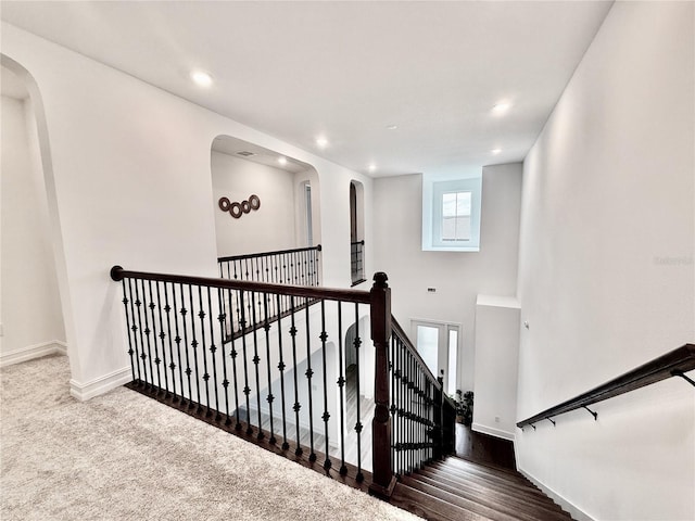 staircase featuring hardwood / wood-style floors