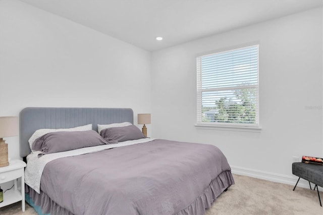 bedroom with light carpet