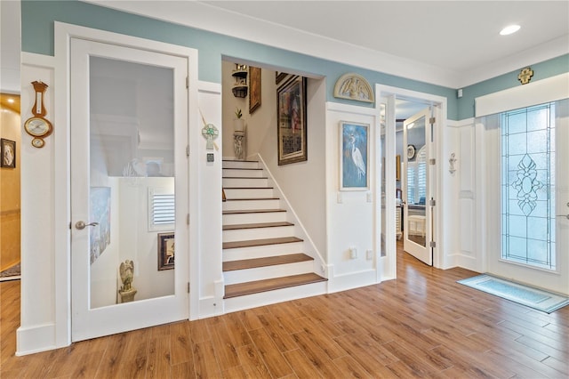 foyer entrance featuring hardwood / wood-style flooring and a wealth of natural light