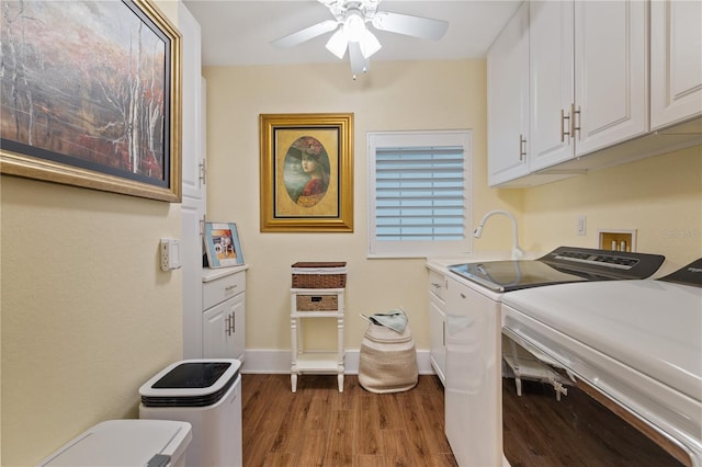 washroom featuring sink, light hardwood / wood-style flooring, ceiling fan, cabinets, and washer and dryer