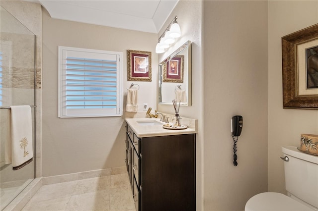 bathroom featuring vanity, a shower, and toilet