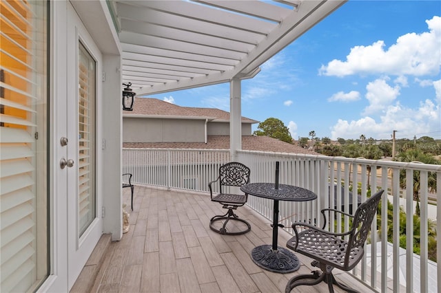 balcony featuring a pergola