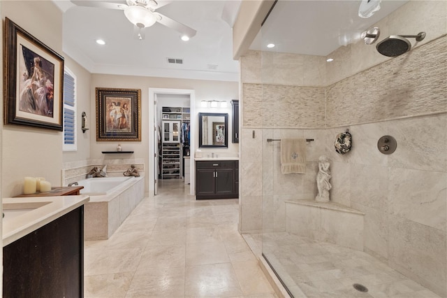 bathroom featuring vanity, ornamental molding, ceiling fan, and plus walk in shower