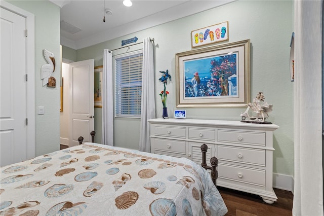 bedroom featuring dark hardwood / wood-style flooring