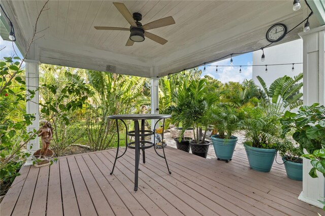 wooden terrace featuring ceiling fan