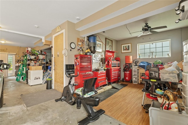 interior space with ceiling fan and a workshop area