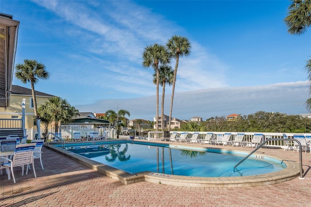 view of swimming pool with a patio area