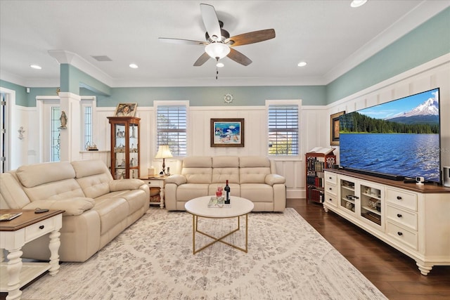 living room with crown molding, ceiling fan, and hardwood / wood-style floors