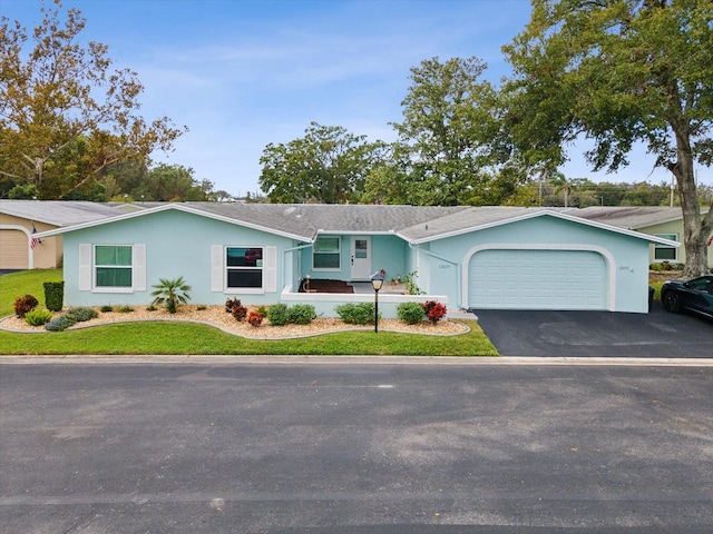 single story home with a garage