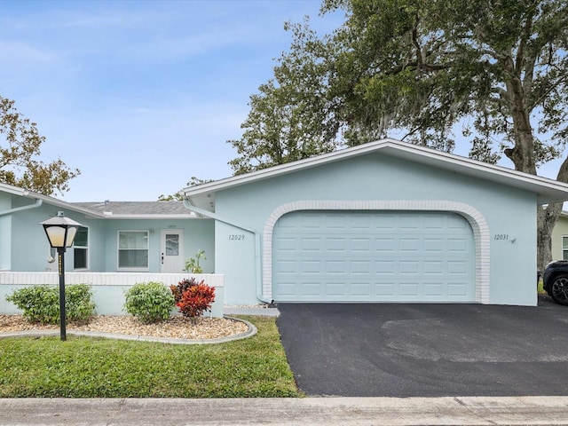 single story home with a garage